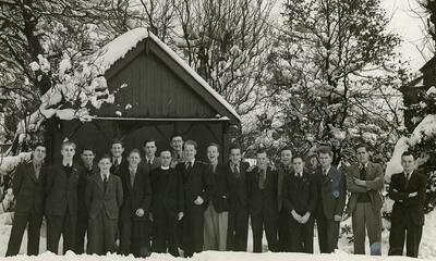 Photograph of pupils at the Belgium College, Buxton, 21 February 1941. The photo is signed on the reverse by some of the pupils stating where they were from. © KADOC, Ref: BE/942855/1745/3664