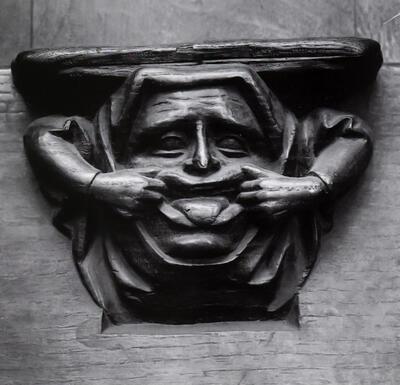 Grimassen makende vrouw, Zitterke of misericorde van het koorgestoelte van de Sint-­Pieterskerk van Leuven, Laat-gotiek