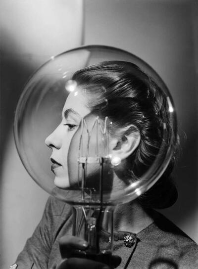 Lee Miller, Model with lightbulb, London, England c.1943