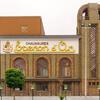 Izegem, De gerestaureerde schoenfabriek met in de gevelfries het opschrift Eperon d’Or en de wapenschilden van België en Luxemburg in ververst bladgoud
